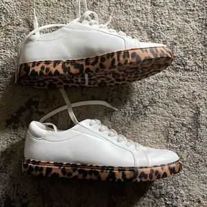 Kenneth Cole white leather lace up sneakers with animal print bottoms.